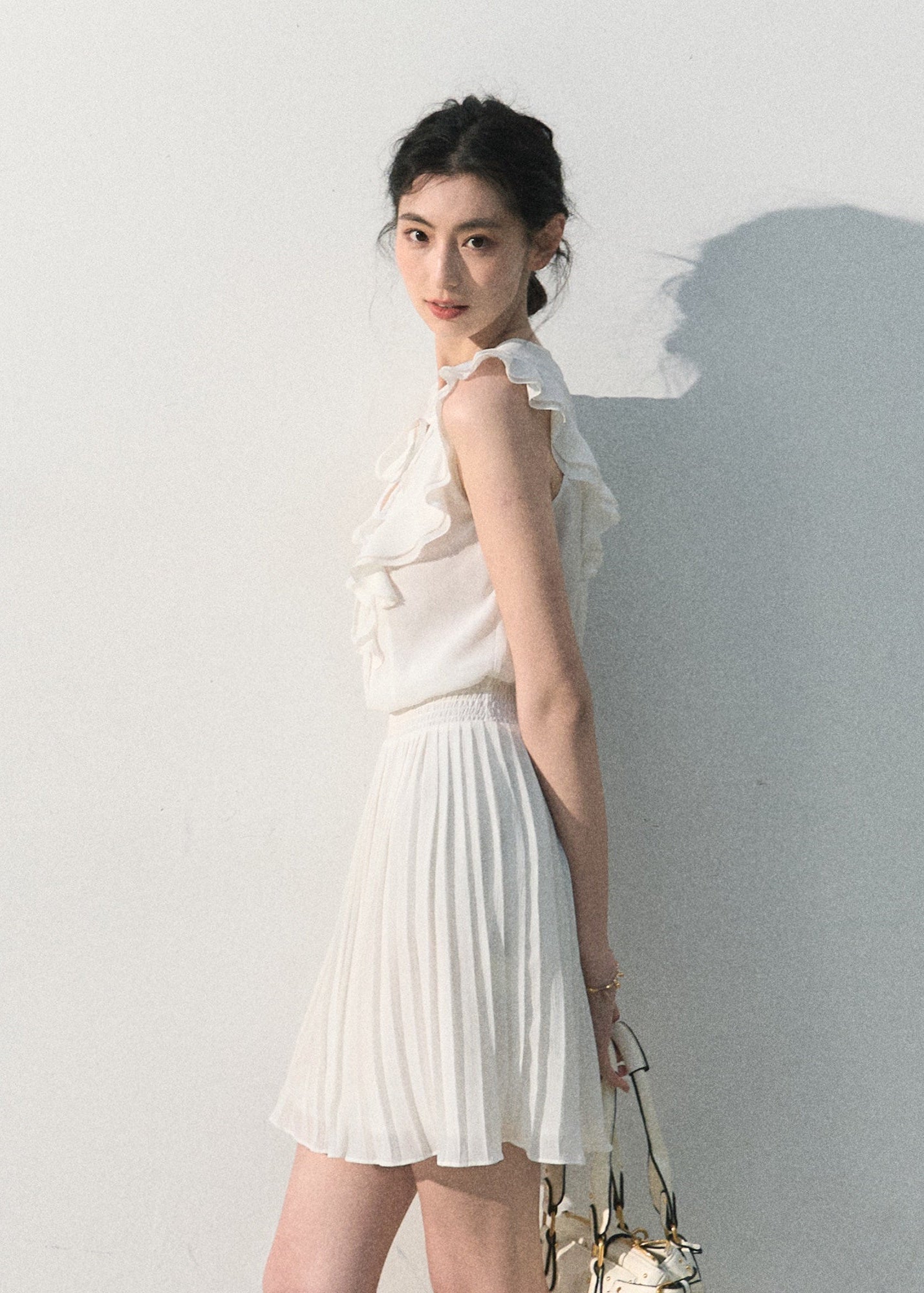 White ruffle pleated dress with a softly defined waist