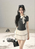 Gray fitted short-sleeve top with ivory lace bow neckline