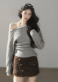 Grey cable knit off-shoulder sweater with decorative side buttons