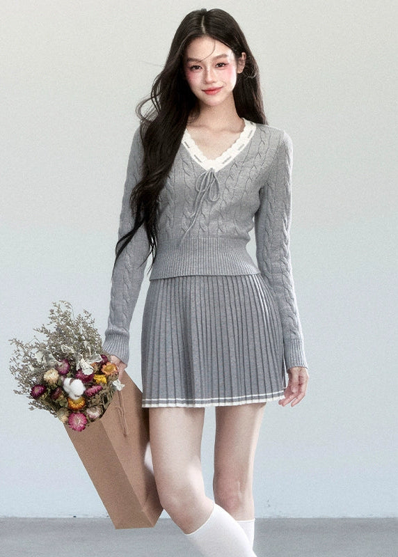 Fragileheart knit skirt set, lace V-neck sweater, pleated mini skirt outfit, luxury Korean fashion, quiet luxury womenswear, pastel noir aesthetic, elegant pre-autumn outfit, grey two-piece knit set, romantic feminine fashion, K-fashion 2025, vintage-inspired knitwear, soft Korean fashion, delicate pleated skirt look, refined knit coordination
