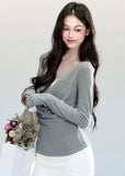 Fragileheart knit top, draped swing blouse, luxury Korean fashion, lace layered knitwear, quiet luxury womenswear, pastel noir aesthetic, grey slim-fit top, elegant autumn outfit, K-fashion 2025, minimalist feminine fashion, modern Korean style, soft two-piece knit, delicate off-shoulder top, refined knit blouse
