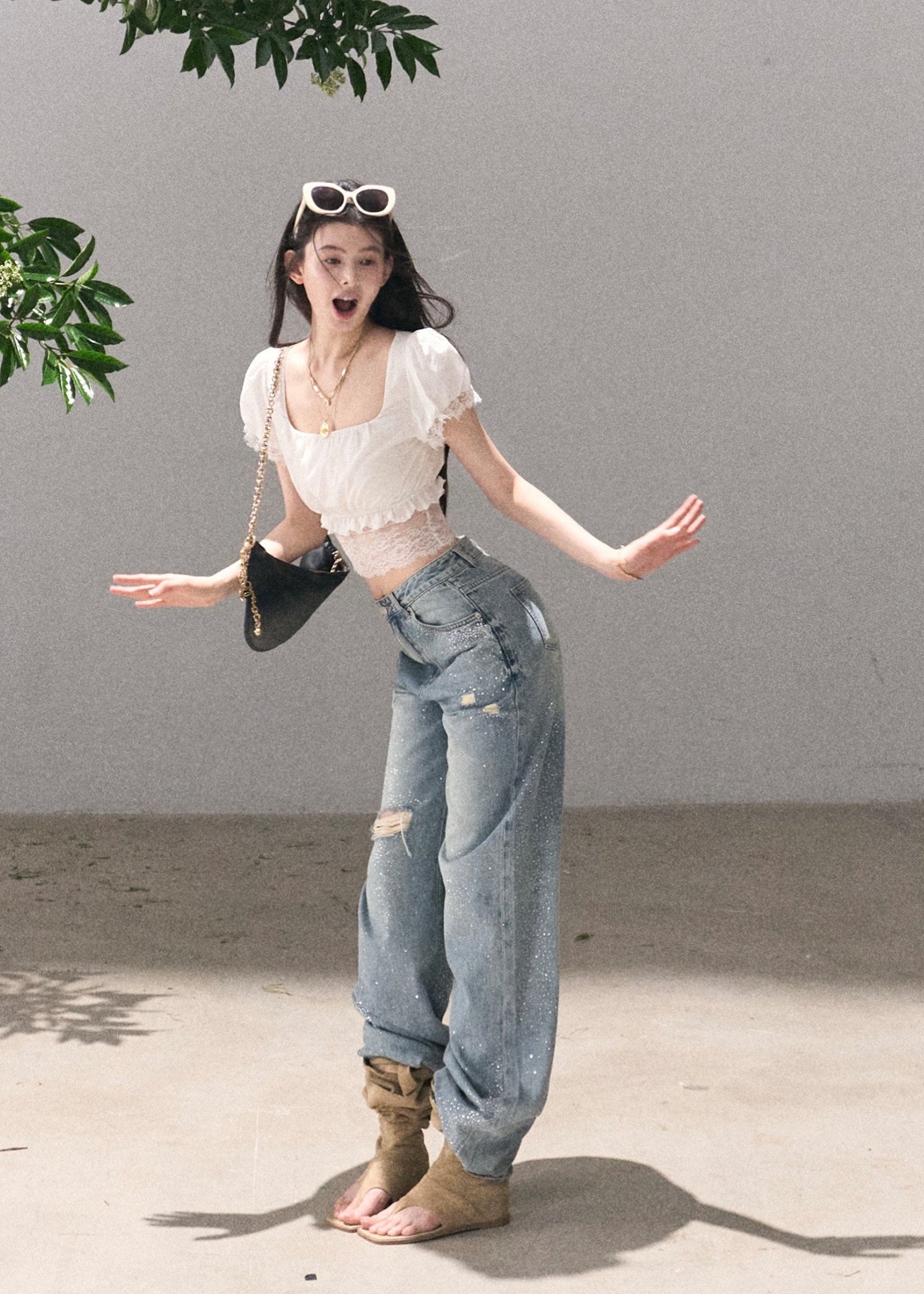 Vintage blue wide-leg jeans styled with a lace crop top