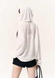 White sheer angel wing zip hoodie styled with fitted black drawstring shorts