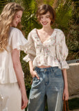 Floral cotton blouse with ruffle V-neckline