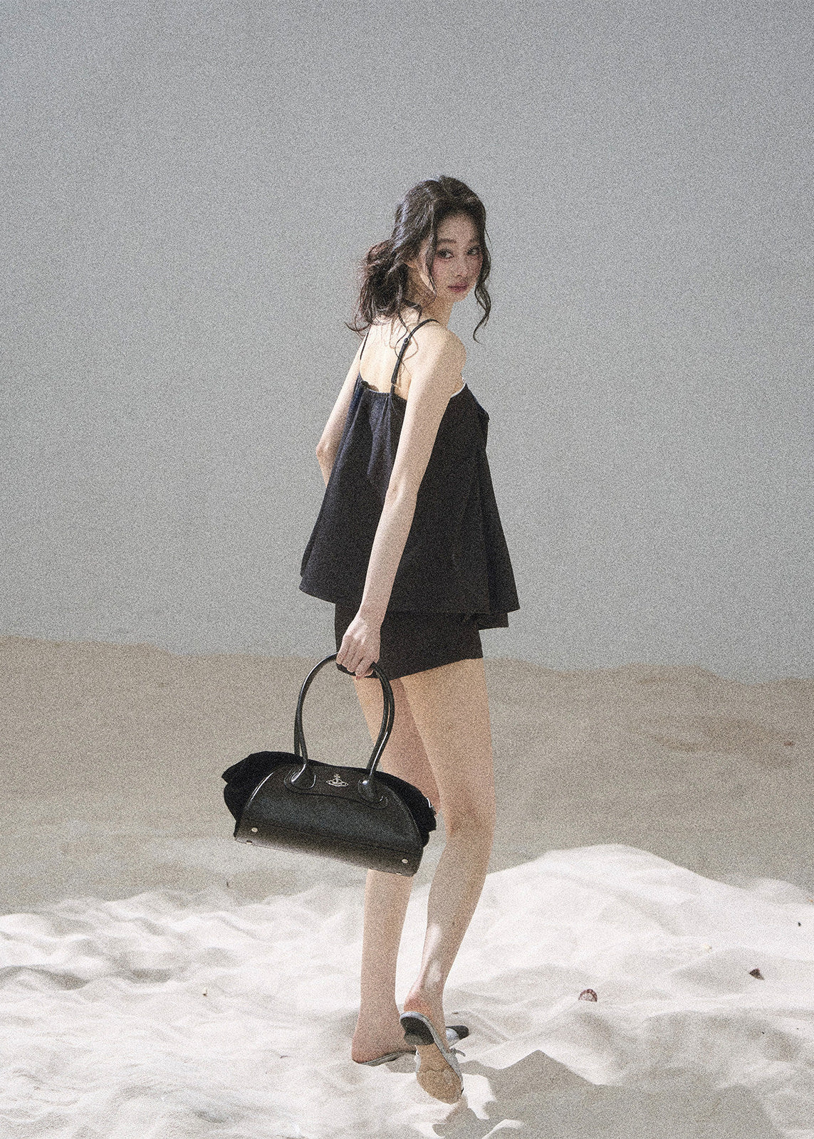 Black camisole top with sparkling embellishments and tailored shorts