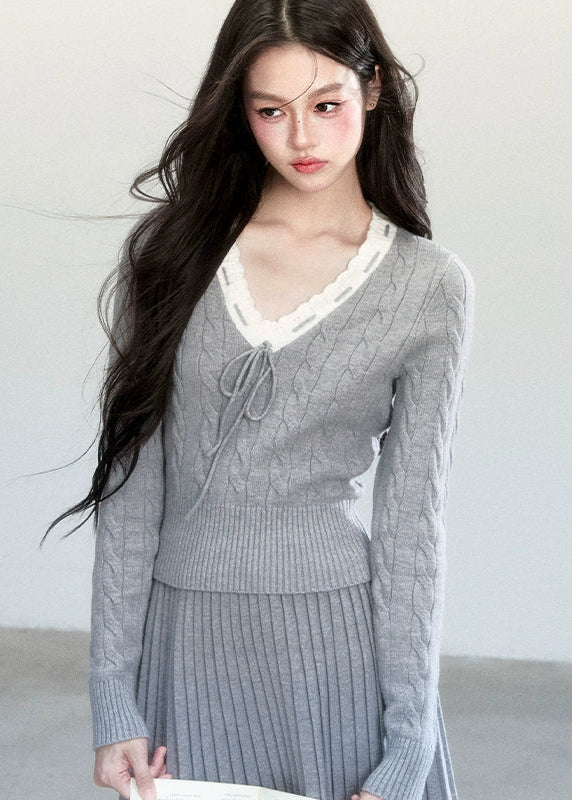 Fragileheart knit skirt set, lace V-neck sweater, pleated mini skirt outfit, luxury Korean fashion, quiet luxury womenswear, pastel noir aesthetic, elegant pre-autumn outfit, grey two-piece knit set, romantic feminine fashion, K-fashion 2025, vintage-inspired knitwear, soft Korean fashion, delicate pleated skirt look, refined knit coordination
