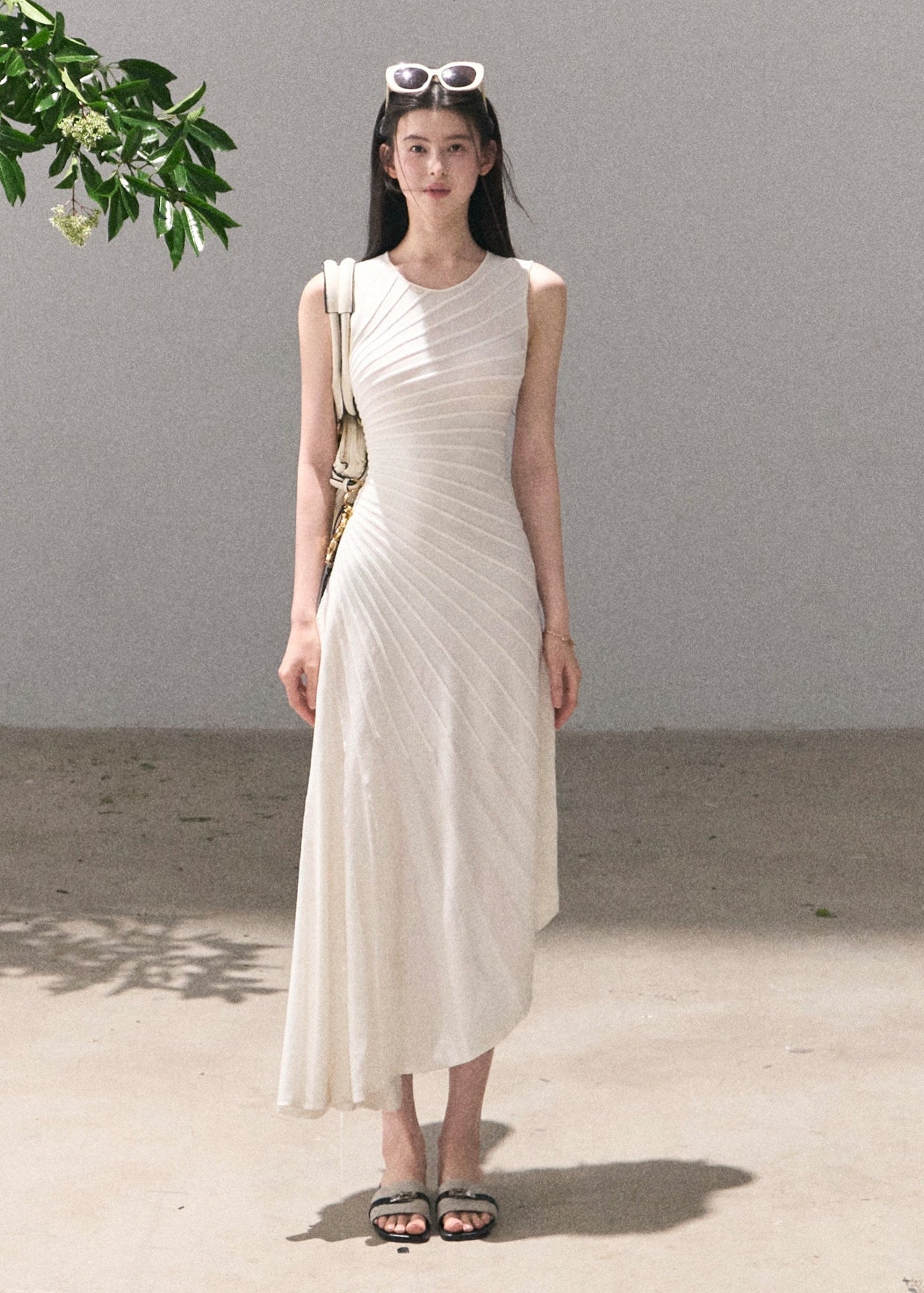 Long white pleated dress with graceful movement
