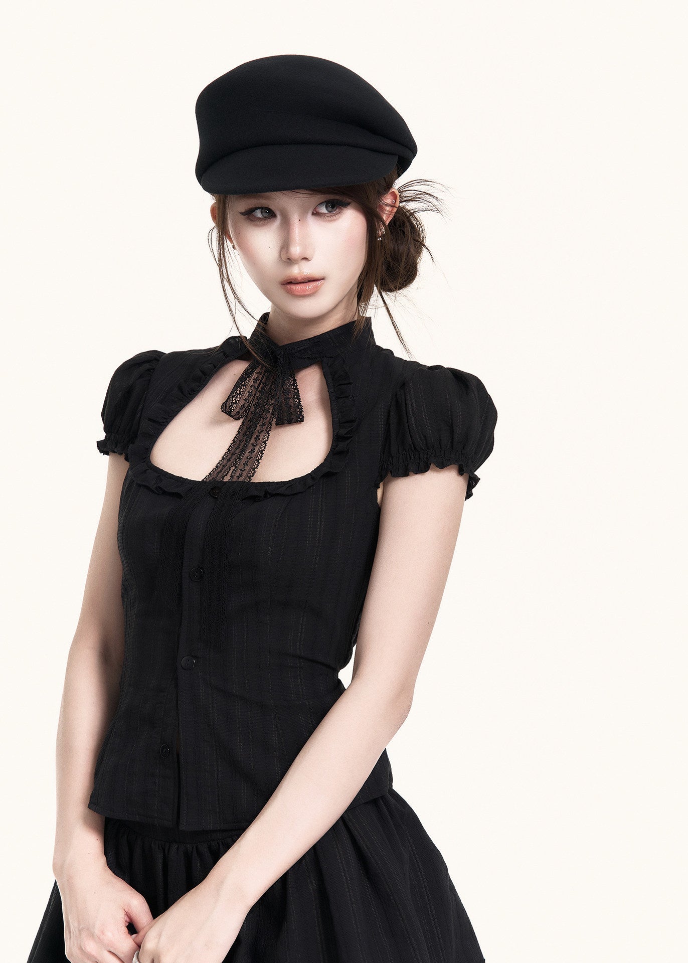 Black short-sleeve top with cutout neckline and lace trim