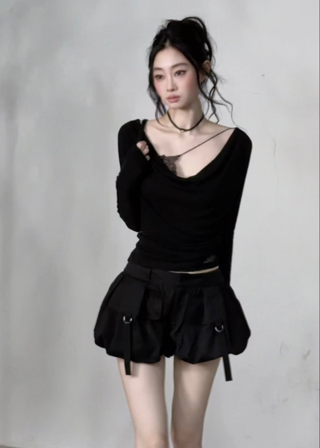 Fitted grey knit top with ruched waist and lace-trim inner layer