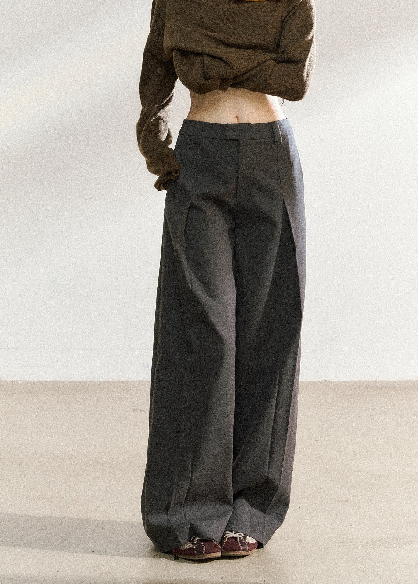 Dark gray relaxed wide-leg trousers with a tailored waistband