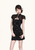 Fitted strapless mini dress styled with a sheer bolero