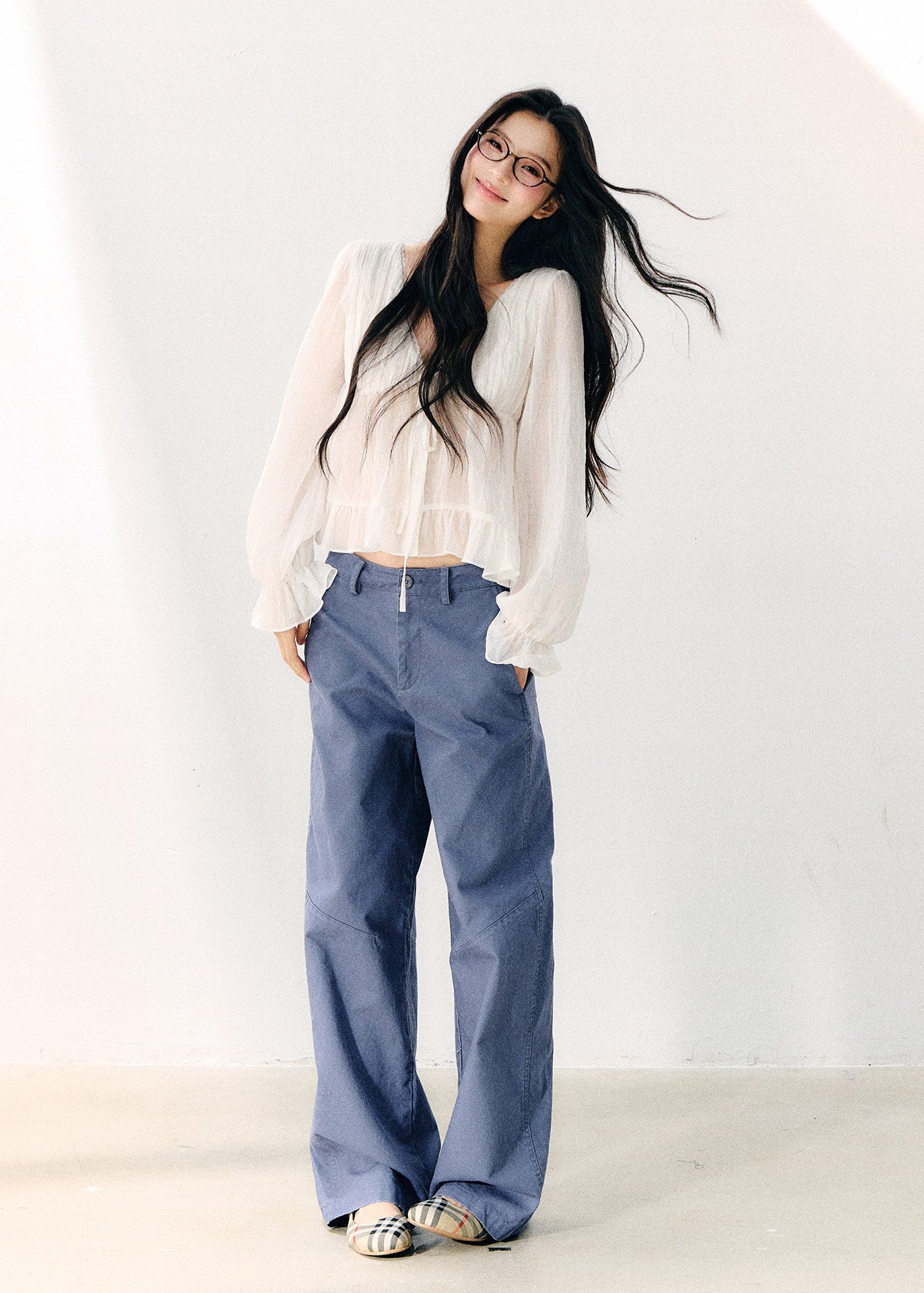 Washed blue straight-leg cotton trousers with a relaxed fit