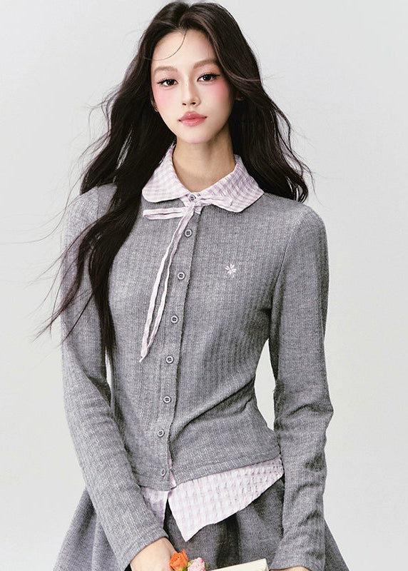 The Moon Academy Knit Set reimagines classic school-girl charm through Fragileheart’s lens of quiet luxury. Featuring a fitted knit blouse with a gingham collar and bow detail, paired with a matching pleated skirt, this ensemble balances intellectual poise and youthful softness. Perfect for autumn transitions and city walks that whisper elegance, not effort.