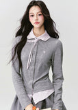 The Moon Academy Knit Set reimagines classic school-girl charm through Fragileheart’s lens of quiet luxury. Featuring a fitted knit blouse with a gingham collar and bow detail, paired with a matching pleated skirt, this ensemble balances intellectual poise and youthful softness. Perfect for autumn transitions and city walks that whisper elegance, not effort.
