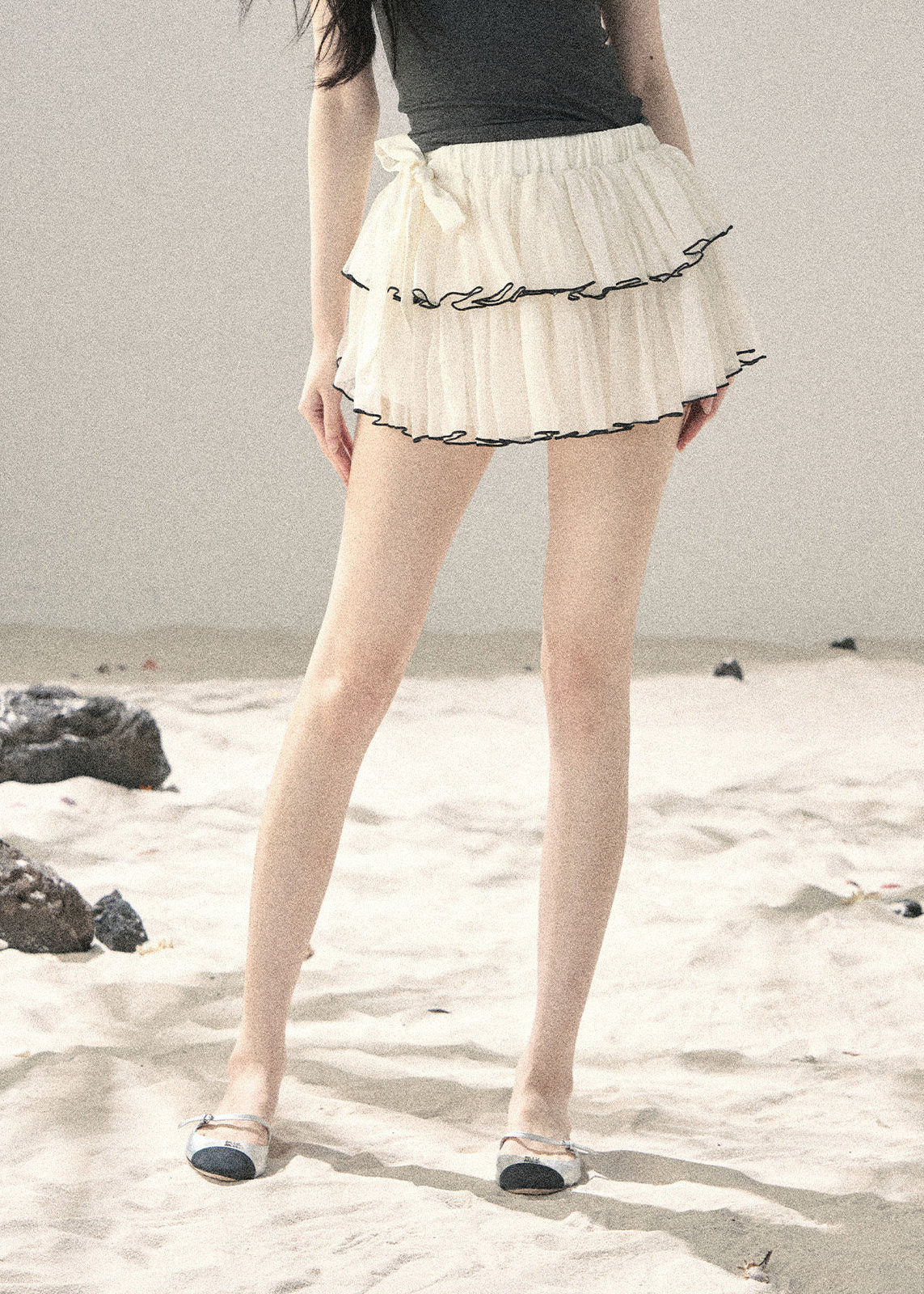 Layered cake mini skirt with black trim detail