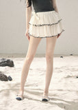 Layered cake mini skirt with black trim detail