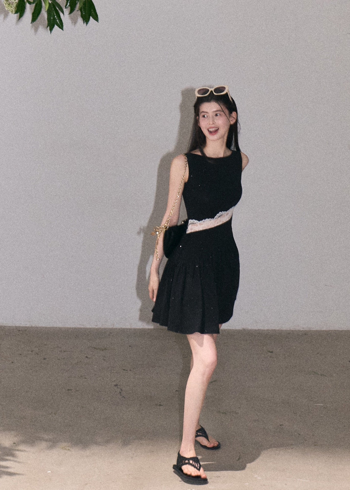 Black resort-style tank dress with semi-sheer lace panel