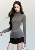 Fragileheart turtleneck top, slim long sleeve shirt, minimalist Korean fashion, quiet luxury womenswear, high neck base top, pastel noir aesthetic, elegant winter outfit, ivory and grey knitwear, modern feminine style, K-fashion 2025, chic commuter outfit, soft ribbed turtleneck, refined Korean fashion, luxury basic top
