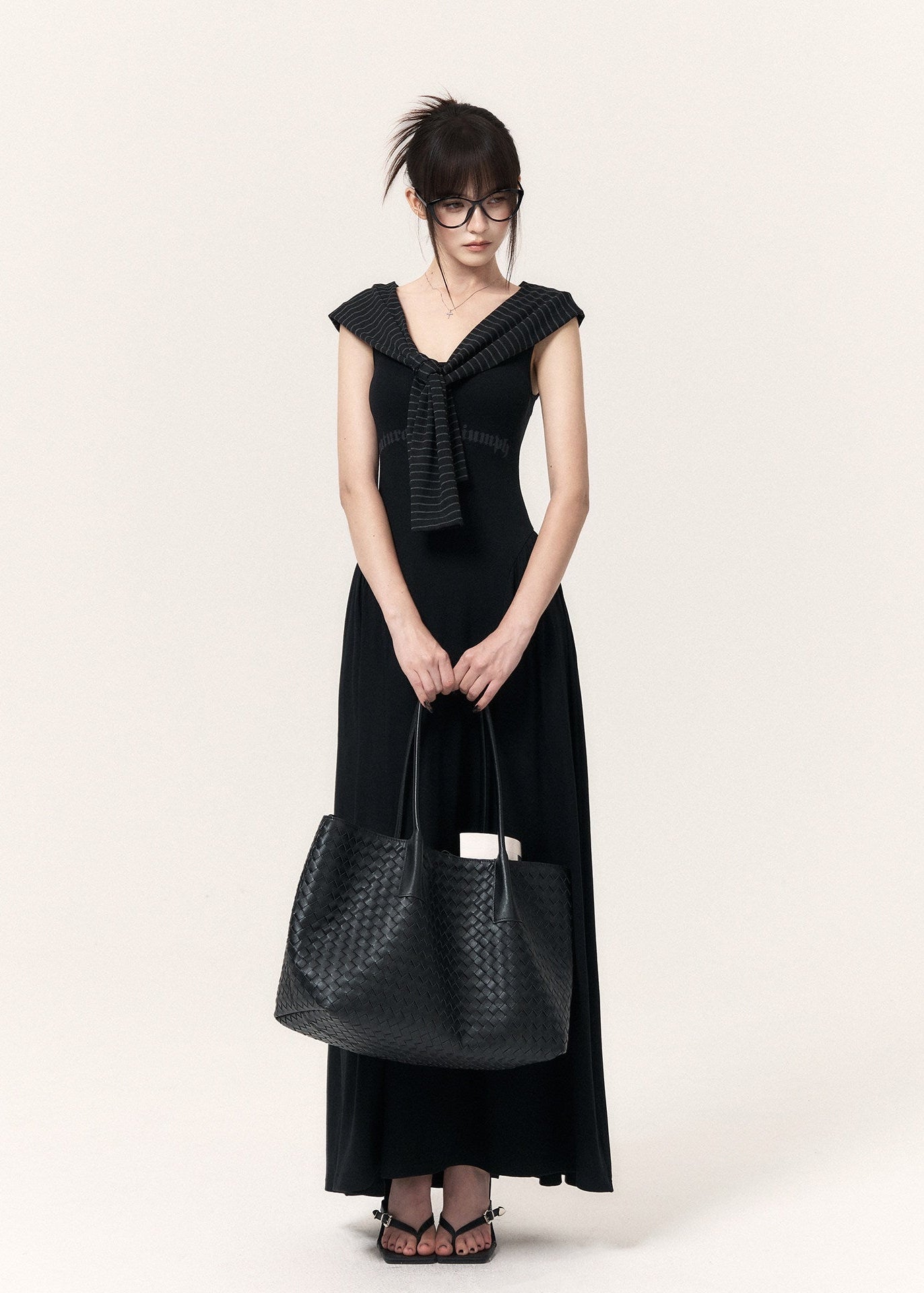Black cross-print knit maxi dress with cropped pinstriped shrug
