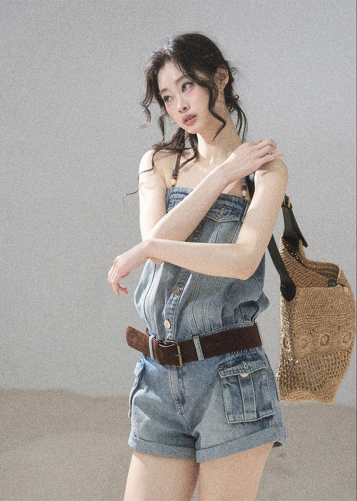 Light wash denim romper with beaded straps