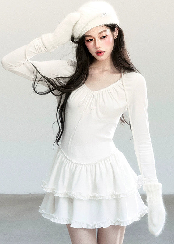 Fragileheart knit dress, ballet style outfit, ivory ruffle one-piece, luxury Korean fashion, quiet luxury womenswear, pastel noir aesthetic, elegant autumn dress, V-neck knit outfit, pre-autumn K-fashion, romantic feminine style, tiered ruffle skirt, soft Korean fashion, delicate white dress, graceful knit one-piece
