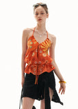 Warm orange drawstring halter top styled with lace shorts