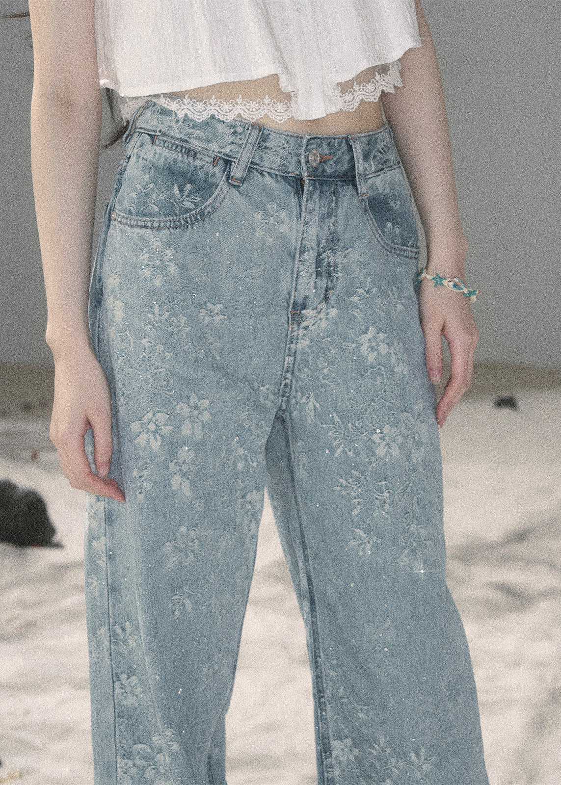 Light blue floral wide-leg jeans with sparkling embellishments