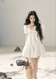 Romantic white mini dress with lace-trim detail