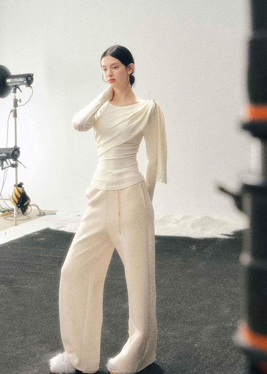 French style knit top, Korean feminine top, one shoulder long sleeve top, draped knit shirt women, winter slim fit top, elegant women knitwear, asymmetrical neckline top, waist slimming top, soft aesthetic fashion, minimal feminine top, Korean winter outfit, French chic clothing, modern women knit top, layering winter top, elegant casual top