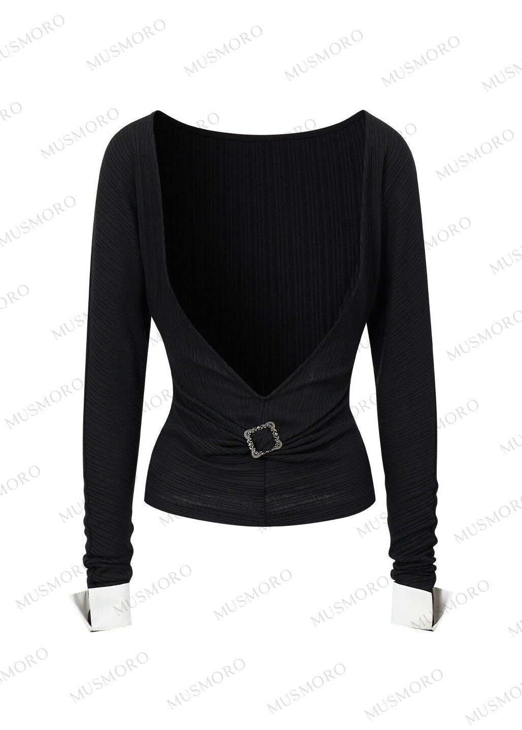 Black knit overlay with waist buckle paired with white button-front shirt