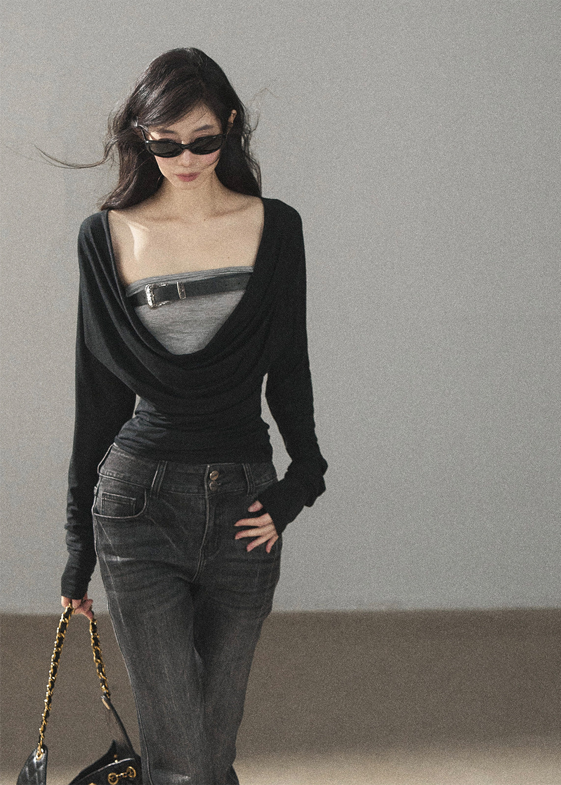Black waist-fit draped top with gray inner layer