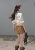 Ivory ribbon-tie cropped blouse with a softly gathered waist