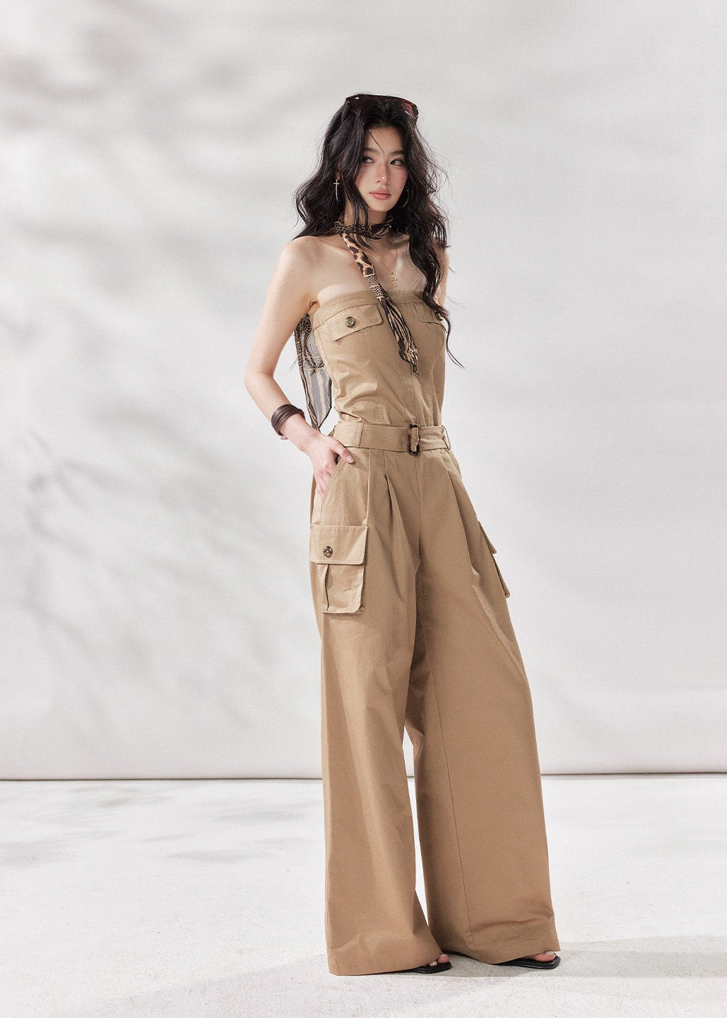 cargo jumpsuit women, strapless jumpsuit women, bandeau jumpsuit, utility jumpsuit women, wide leg jumpsuit women, summer jumpsuit outfit women, beige jumpsuit women, modern minimal outfit women, street style jumpsuit women, fashion forward jumpsuit, elevated casual outfit women, one piece outfit women, trendy cargo outfit women, chic summer jumpsuit, stylish utility outfit