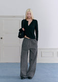 Model wearing gray plaid wide-leg pants with vintage lace waist detailing