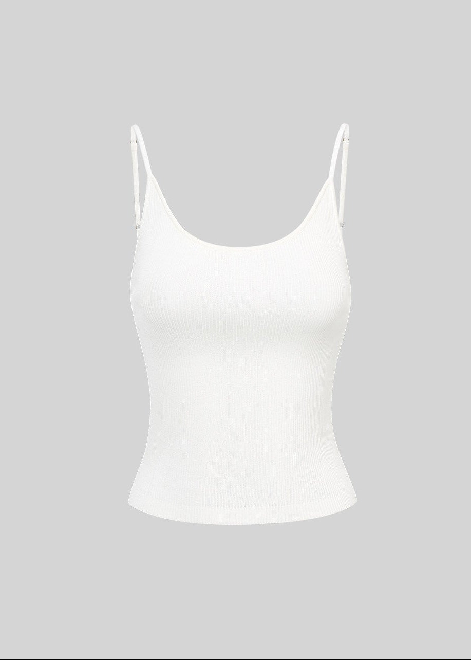 White ribbed camisole with slender straps styled with a gray cardigan and dark shorts