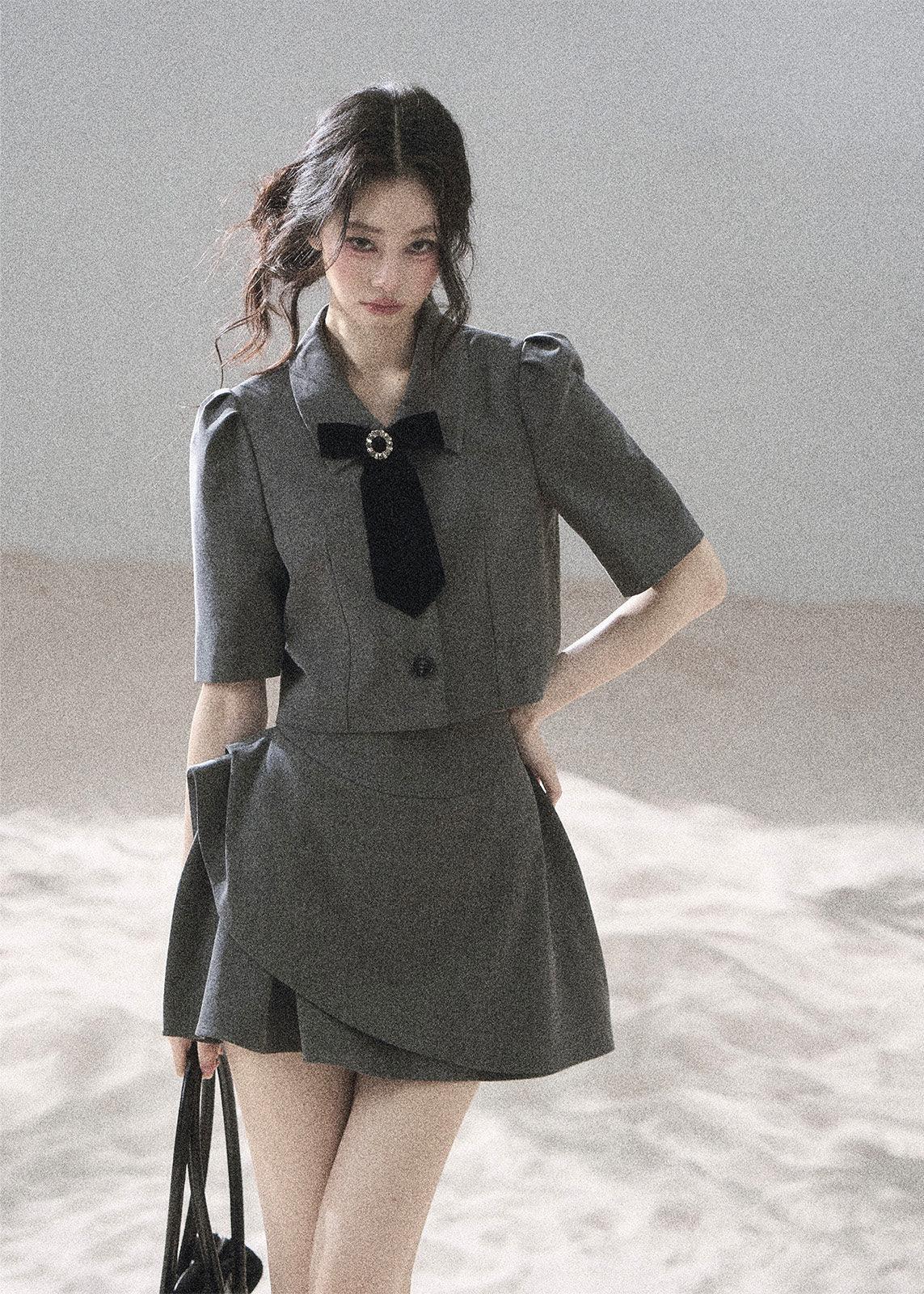 Gray cropped blazer and mini skirt set with black velvet bow