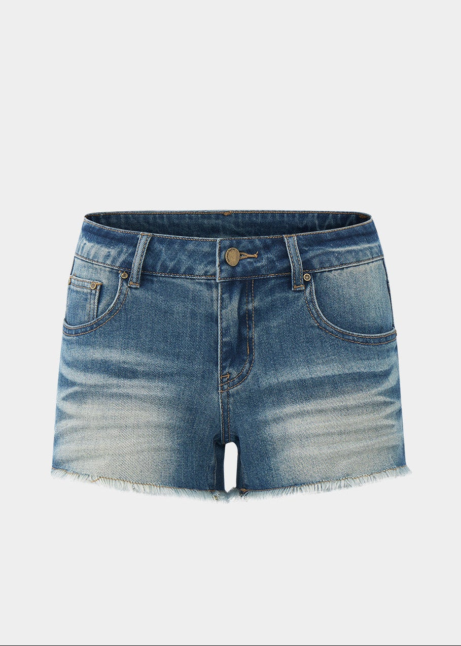 low rise denim shorts, vintage denim shorts, fringe denim shorts, distressed denim shorts, cat whisker shorts, American vintage shorts, women’s hot shorts, casual denim shorts, summer denim shorts, frayed hem shorts, Korean feminine styling, resort denim shorts, cotton blend denim shorts, washed denim shorts, vacation shorts outfit
