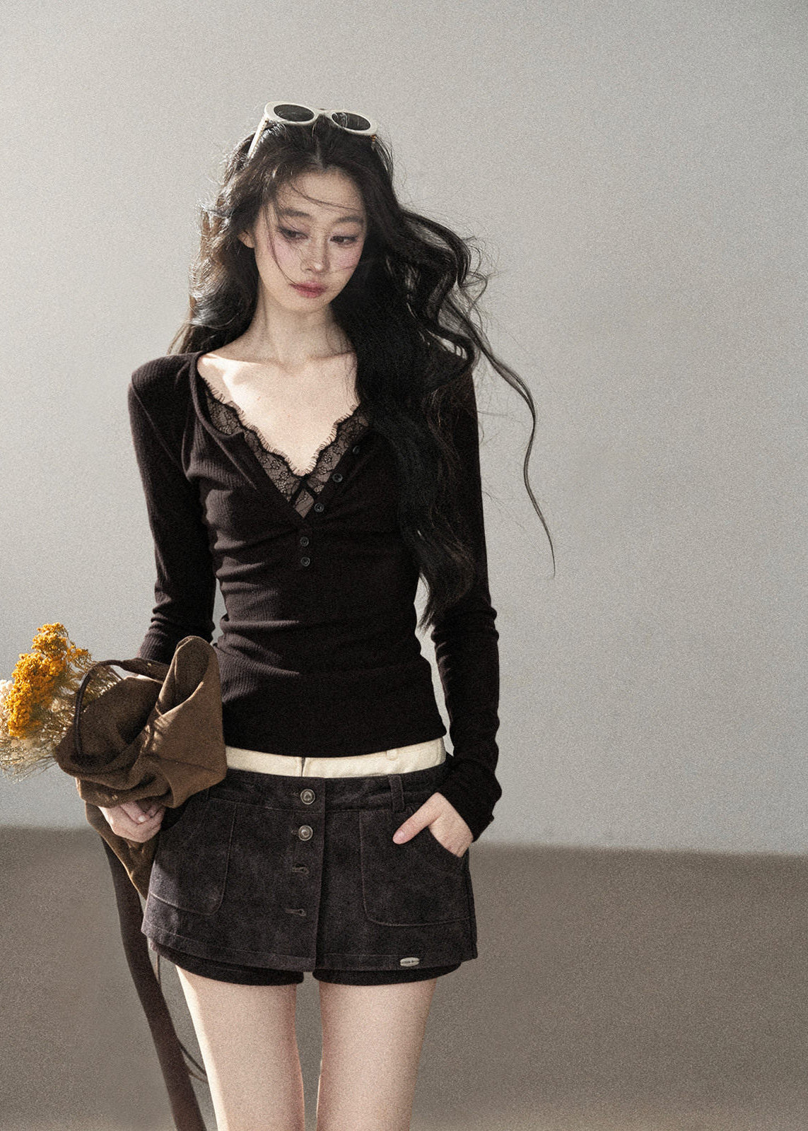 Black lace-trim V-neck knit top with ruched bust and long sleeves