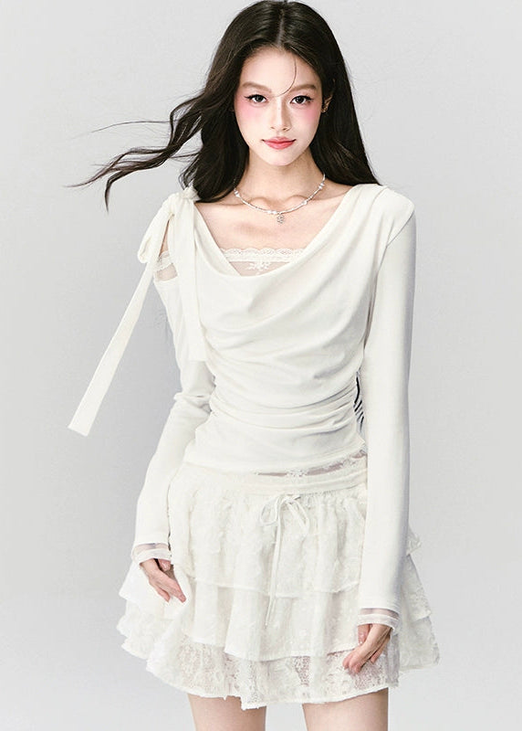 Soft as a dream, elegant as silence — the Cream Reverie Lace Top captures Fragileheart’s signature “pastel meets noir” allure. The cowl neckline and lace underlayer reveal a graceful décolleté, while the sculpted waist flatters the silhouette with effortless poise. Perfect for autumn and winter ensembles that balance luxury and intimacy.