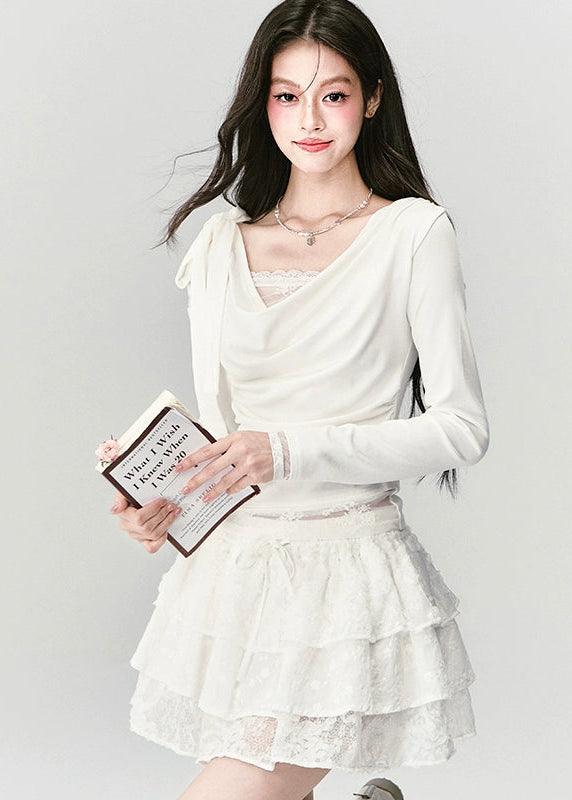 Soft as a dream, elegant as silence — the Cream Reverie Lace Top captures Fragileheart’s signature “pastel meets noir” allure. The cowl neckline and lace underlayer reveal a graceful décolleté, while the sculpted waist flatters the silhouette with effortless poise. Perfect for autumn and winter ensembles that balance luxury and intimacy.