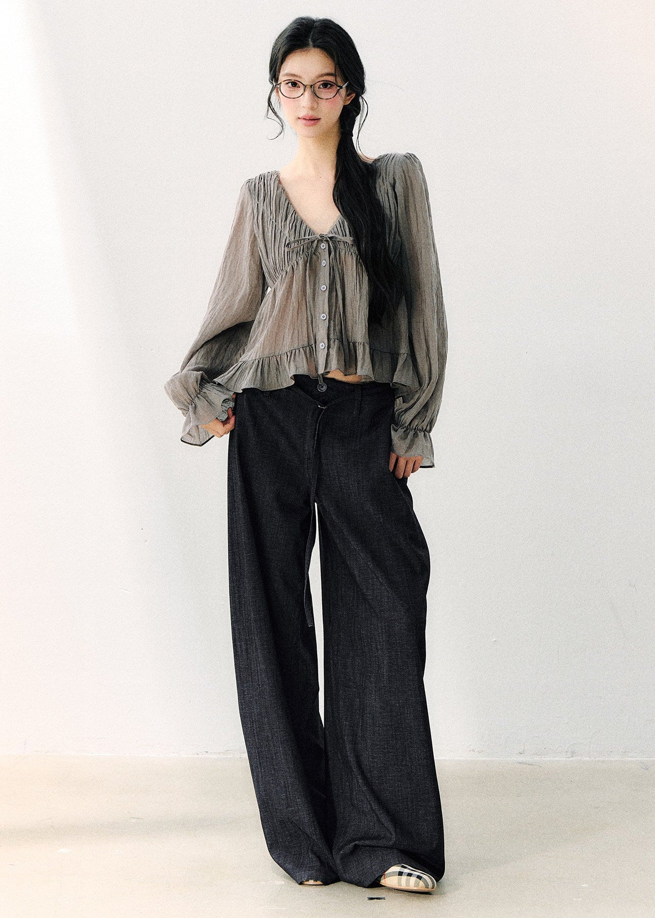 Smoky gray ruffled V-neck blouse with front ties