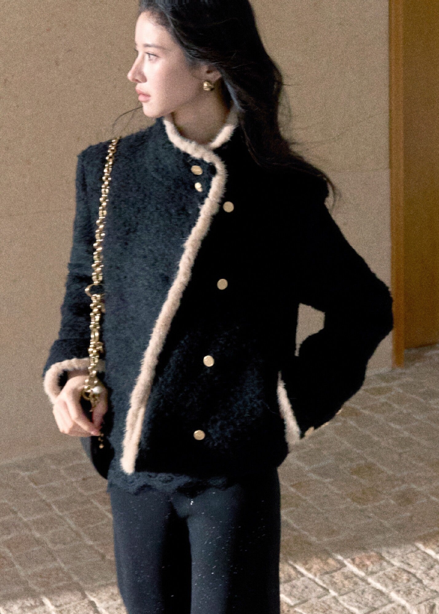 Black wool blend jacket with contrasting cream trim and gold buttons