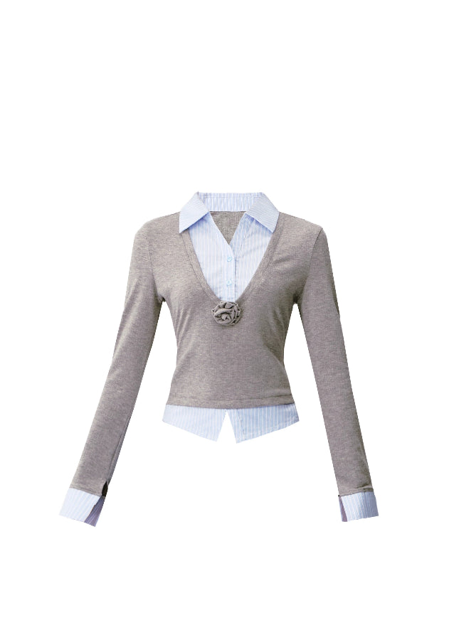 A quiet evolution of the preppy muse — the Blue Prelude Layered Shirt blends striped academia with Fragileheart’s signature delicate poise. The faux two-piece design layers a mist-grey knit over a powder-blue shirt, finished with a minimalist floral accent at the chest. A study in balance, it redefines the modern school-girl aesthetic with luxury subtlety.