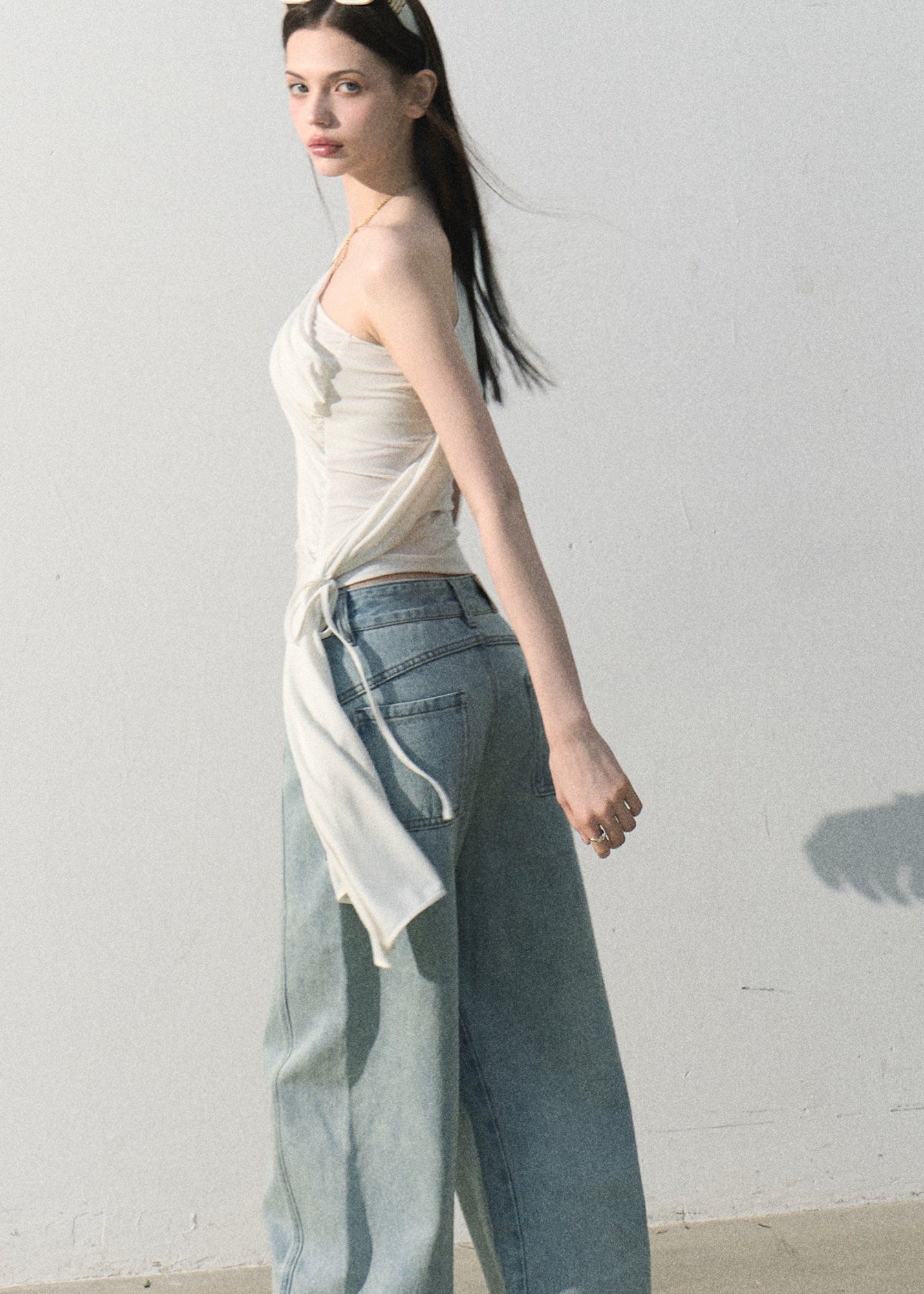 Soft asymmetrical shoulder top styled with relaxed blue jeans