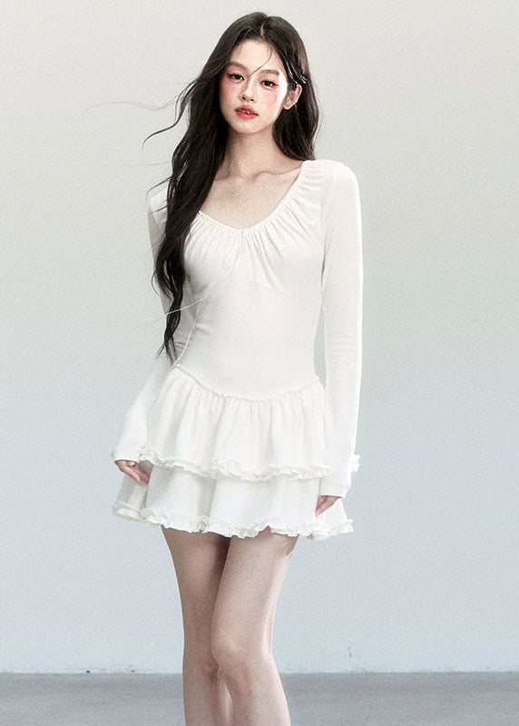 Fragileheart knit dress, ballet style outfit, ivory ruffle one-piece, luxury Korean fashion, quiet luxury womenswear, pastel noir aesthetic, elegant autumn dress, V-neck knit outfit, pre-autumn K-fashion, romantic feminine style, tiered ruffle skirt, soft Korean fashion, delicate white dress, graceful knit one-piece
