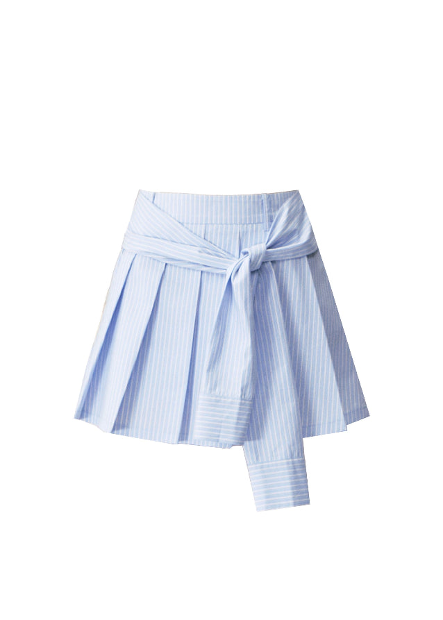 A quiet evolution of the preppy muse — the Blue Prelude Layered Shirt blends striped academia with Fragileheart’s signature delicate poise. The faux two-piece design layers a mist-grey knit over a powder-blue shirt, finished with a minimalist floral accent at the chest. A study in balance, it redefines the modern school-girl aesthetic with luxury subtlety.