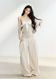 Beige high-waisted wide-leg trousers with side pleats