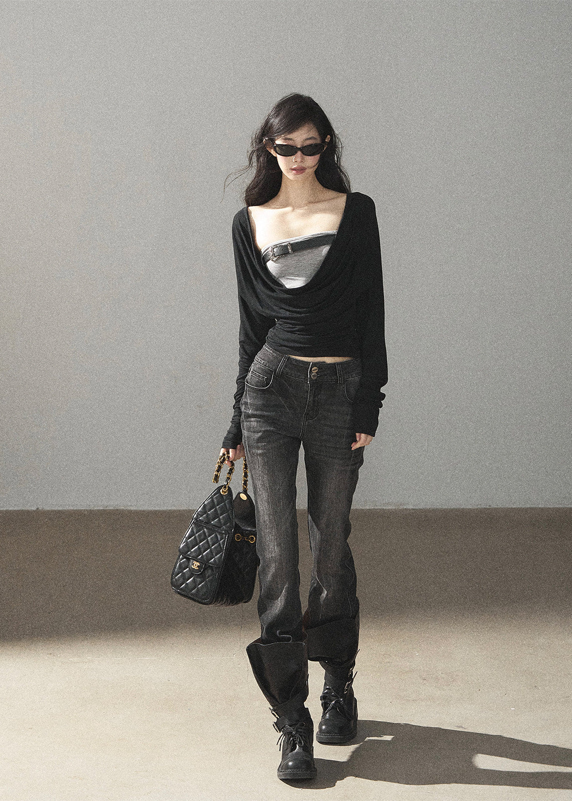 Black waist-fit draped top with gray inner layer