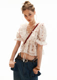 V-neck tie cardigan top styled with wide-leg jeans