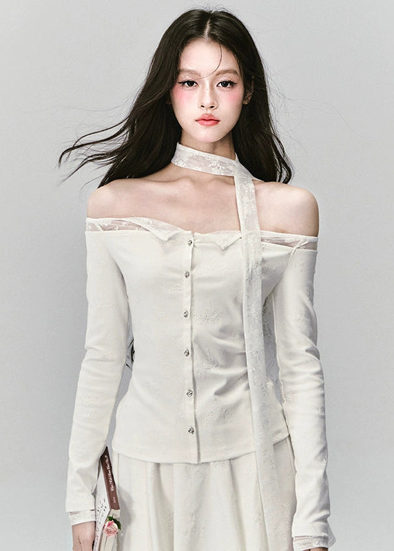 Ethereal and composed, the White Moonlight Sonata Set embodies Fragileheart’s quiet-luxury vision. The off-shoulder lace top and embroidered skirt whisper of moonlit evenings and polished confidence. Soft satin sheen meets delicate tailoring, creating a timeless silhouette that speaks of grace without needing attention.